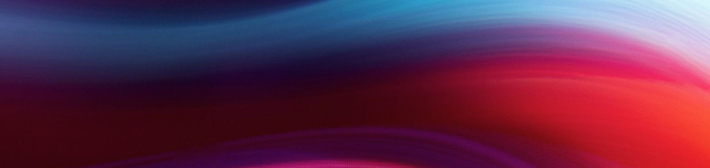 Abstract waves of blue and red blend gracefully, creating a dynamic and serene gradient. The flowing colors evoke a sense of calm and movement.